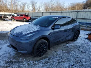 2023 Tesla Model Y Long Range with VIN 7SAYGDEE6PF752570, listed as a Copart auction lot 84927794 with 52,297 mi miles and Salvage Title. Bid and sale history available at DreamBid. Image 1.