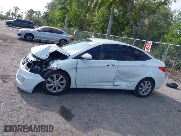 2014 Hyundai Accent GLS with VIN KMHCU4AE8EU608539, listed as a IAAI auction lot 41946784 with 106,709 mi miles and . Bid and sale history available at carsss.com. Image 13.