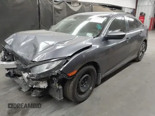 2020 Honda Civic LX with VIN 19XFC2F67LE006057, listed as a IAAI auction lot 42032759 with 119,319 mi miles and . Bid and sale history available at DreamBid. Image 2.