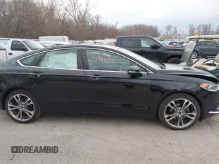 2017 Ford Fusion Titanium z VIN 3FA6P0K98HR200272, wystawiony jako IAAI lot #41905017 z przebiegiem 104 132 mil mil oraz . Historia ofert i sprzedaży dostępna na DreamBid. Obrazek 13.