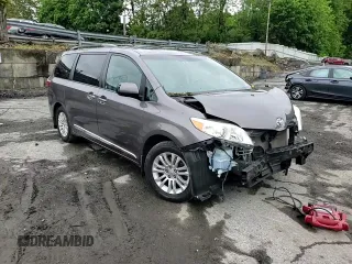 2015 Toyota Sienna XLE with VIN 5TDYK3DC4FS659692, listed as a Copart auction lot 57248355 with 121,644 mi miles and Salvage title. Bid and sale history available at DreamBid. Image 15.