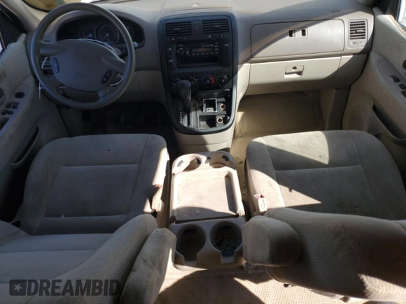 2004 Kia Sedona LX with VIN KNDUP131046585706, listed as a Copart auction lot 74973304 with 107,130 mi miles and Salvage Title. Bid and sale history available at carsss.com. Image 8.
