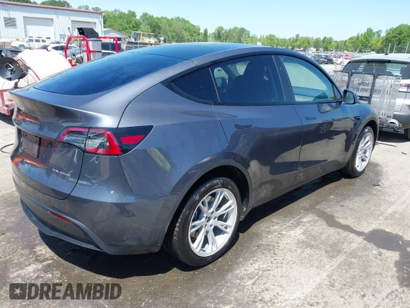 2023 Tesla Model Y Long Range with VIN 7SAYGDEE5PF882582, listed as a IAAI auction lot 42059015 with 10,567 mi miles and . Bid and sale history available at carsss.com. Image 4.