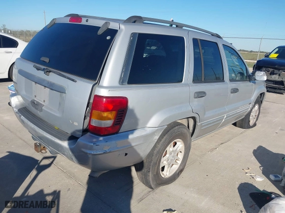 2004 Jeep Grand Cherokee Laredo with VIN 1J4GX48NX4C403936, listed as a IAAI auction lot 40855256 with 241,290 mi miles. Bid and sale history available at carsss.com. Image 4.