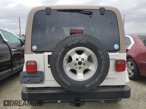 2002 Jeep Wrangler Sahara with VIN 1J4FA59S02P727359, listed as a Copart auction lot 74823414 with 84,186 mi miles and Salvage Title. Bid and sale history available at carsss.com. Image 6.