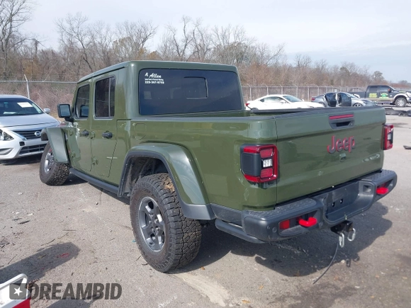 2023 Jeep Gladiator Rubicon with VIN 1C6JJTBGXPL586154, listed as a IAAI auction lot 41370352 with 11,207 mi miles and . Bid and sale history available at DreamBid. Image 3.