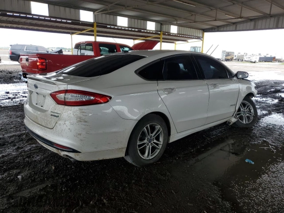 2016 Ford Fusion Titanium Hybrid with VIN 3FA6P0RUXGR314220, listed as a Copart auction lot 61512404 with 152,067 mi miles and Salvage Title. Bid and sale history available at carsss.com. Image 3.