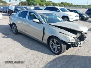 2015 Cadillac CTS RWD with VIN 1G6AP5SXXF0121704, listed as a IAAI auction lot 41712551 with 131,807 mi miles and . Bid and sale history available at DreamBid. Image 1.