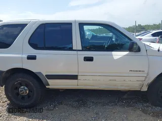 1998 Isuzu Rodeo with VIN 4S2CK58D3W4301606, listed as a IAAI auction lot 42453329 with 219,433 mi miles and . Bid and sale history available at DreamBid. Image 13.