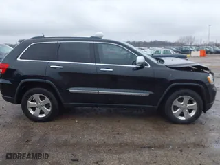 2013 Jeep Grand Cherokee Limited with VIN 1C4RJFBG4DC633137, listed as a IAAI auction lot 41235064 with 163,820 mi miles. Bid and sale history available at carsss.com. Image 14.