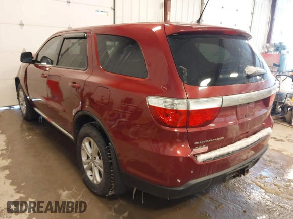 2013 Dodge Durango SXT with VIN 1C4RDJAG4DC527945, listed as a IAAI auction lot 41590545 with 141,074 mi miles and . Bid and sale history available at DreamBid. Image 3.