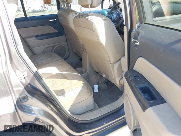 2014 Jeep Patriot Latitude with VIN 1C4NJPFA5ED928074, listed as a IAAI auction lot 42035754 with 155,636 mi miles and . Bid and sale history available at carsss.com. Image 8.