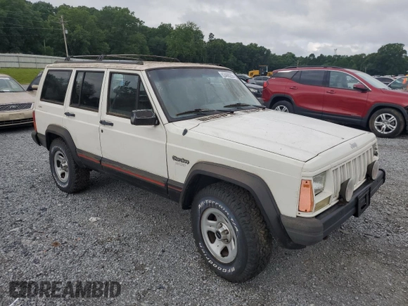 1996 Jeep Cherokee Sport z VIN 1J4FJ68S3TL103684, wystawiony jako Copart lot #63466265 z przebiegiem 163 715 mil mil oraz Czysty tytuł • Clean title. Historia ofert i sprzedaży dostępna na DreamBid. Obrazek 4.