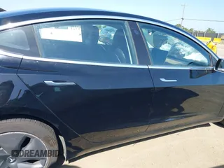 2018 Tesla Model 3 Long Range Battery with VIN 5YJ3E1EA7JF057031, listed as a IAAI auction lot 42139832 with 92,618 mi miles and . Bid and sale history available at DreamBid. Image 12.