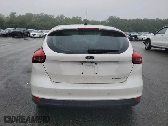 2016 Ford Focus Titanium with VIN 1FADP3N2XGL321275, listed as a Copart auction lot 61282845 with 111,519 mi miles and Salvage title. Bid and sale history available at DreamBid. Image 6.