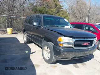 2003 GMC Yukon SLT with VIN 1GKEC13V23R135379, listed as a IAAI auction lot 41637458 with 236,134 mi miles. Bid and sale history available at carsss.com. Image 1.