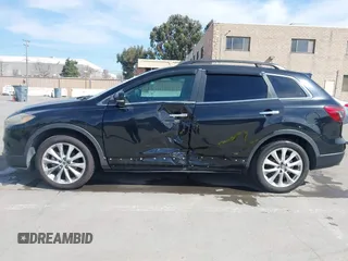 2015 Mazda CX-9 Grand Touring z VIN JM3TB2DA4F0450014, wystawiony jako IAAI lot #41692935 z przebiegiem 90 800 mil mil oraz . Historia ofert i sprzedaży dostępna na DreamBid. Obrazek 14.