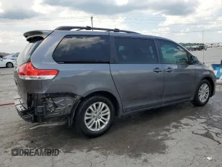 2014 Toyota Sienna XLE with VIN 5TDYK3DC6ES456558, listed as a Copart auction lot 63106085 with 231,260 mi miles and Salvage title. Bid and sale history available at DreamBid. Image 3.