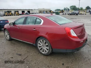 2013 Lincoln MKS EcoBoost with VIN 1LNHL9FTXDG606799, listed as a Copart auction lot 57469995 with 80,168 mi miles and Salvage title. Bid and sale history available at DreamBid. Image 2.