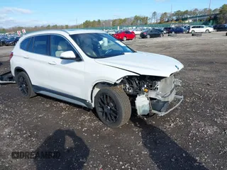 2018 BMW X1 xDrive28i with VIN WBXHT3C34J5L29714, listed as a IAAI auction lot 41825126 with 89,970 mi miles. Bid and sale history available at carsss.com. Image 1.