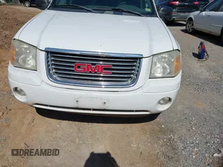 2004 GMC Envoy SLE with VIN 1GKDT13S442223832, listed as a IAAI auction lot 41845628 with 265,898 mi miles. Bid and sale history available at carsss.com. Image 13.
