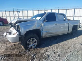 2016 Chevrolet Silverado 1500 LT with VIN 3GCUKREC0GG131034, listed as a IAAI auction lot 41289762 with 176,978 mi miles and . Bid and sale history available at DreamBid. Image 2.