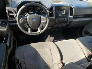 2015 Ford F-150 XL with VIN 1FTEX1C88FFC26544, listed as a Copart auction lot 48242705 with 124,731 mi miles and Salvage Title. Bid and sale history available at carsss.com. Image 8.