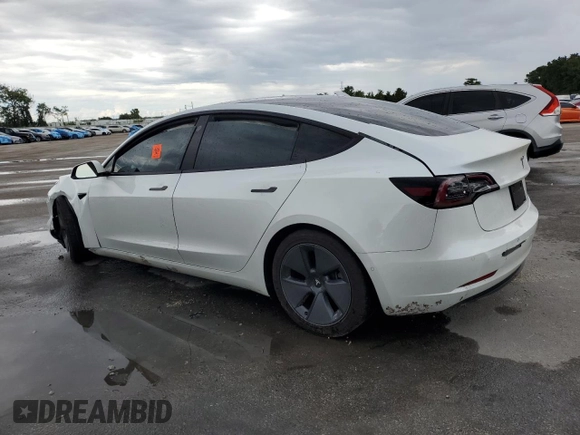 2021 Tesla Model 3 Standard Range Plus z VIN 5YJ3E1EA2MF859832, wystawiony jako Copart lot #56743865 z przebiegiem 77 025 mil mil oraz Nie do naprawy. Historia ofert i sprzedaży dostępna na DreamBid. Obrazek 2.