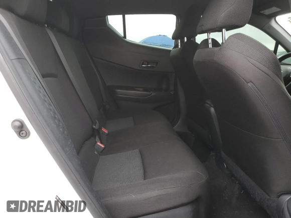 2019 Toyota C-HR XLE z VIN JTNKHMBX7K1028552, wystawiony jako Copart lot #55490905 z przebiegiem 127 397 mil mil oraz Szkoda całkowita • Salvage title. Historia ofert i sprzedaży dostępna na DreamBid. Obrazek 10.