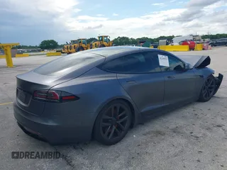 2023 Tesla Model S with VIN 5YJSA1E54PF501565, listed as a IAAI auction lot 42244953 with Not provided miles and . Bid and sale history available at DreamBid. Image 4.