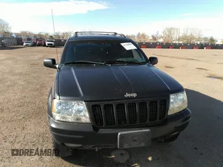 1999 Jeep Grand Cherokee Limited with VIN 1J4GW68N8XC770305, listed as a IAAI auction lot 41720558 with 206,180 mi miles. Bid and sale history available at carsss.com. Image 6.