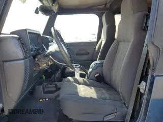 2005 Jeep Wrangler Rubicon with VIN 1J4FA69S05P351725, listed as a Copart auction lot 71411904 with 144,557 mi miles and Salvage Title. Bid and sale history available at carsss.com. Image 7.