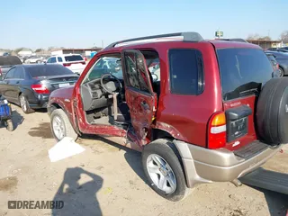 2002 Suzuki Grand Vitara JLX with VIN JS3TD62V824152943, listed as a IAAI auction lot 41668395 with 104,191 mi miles. Bid and sale history available at carsss.com. Image 3.