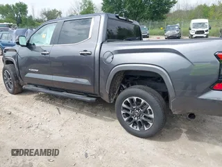 2025 Toyota Tundra Limited with VIN 5TFJA5DB2SX257293, listed as a IAAI auction lot 42742408 with 7,629 mi miles and . Bid and sale history available at DreamBid. Image 3.
