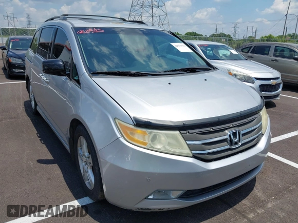 2011 Honda Odyssey Touring with VIN 5FNRL5H99BB058448, listed as a IAAI auction lot 42651432 with 208,581 mi miles and . Bid and sale history available at DreamBid. Image 1.