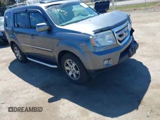 2011 Honda Pilot Touring with VIN 5FNYF4H95BB090892, listed as a IAAI auction lot 41878404 with 131,757 mi miles. Bid and sale history available at carsss.com. Image 1.