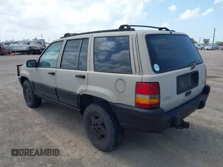 1995 Jeep Grand Cherokee Laredo with VIN 1J4GZ58Y5SC541987, listed as a IAAI auction lot 42430890 with 246,824 mi miles and . Bid and sale history available at DreamBid. Image 3.