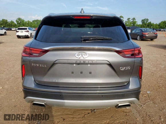 2023 Infiniti QX50 Luxe z VIN 3PCAJ5BA3PF105275, wystawiony jako Copart lot #61144205 z przebiegiem 26 399 mil mil oraz Szkoda całkowita • Salvage title. Historia ofert i sprzedaży dostępna na DreamBid. Obrazek 6.
