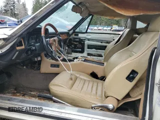 1989 Jaguar XJS z VIN SAJNA5840KC150684, wystawiony jako Copart lot #48081805 z przebiegiem 93 444 mil mil oraz Czysty tytuł • Clean title. Historia ofert i sprzedaży dostępna na DreamBid. Obrazek 7.