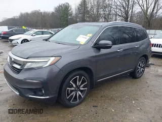 2021 Honda Pilot Touring 8-Passenger with VIN 5FNYF5H9XMB014190, listed as a IAAI auction lot 41749586 with 67,602 mi miles and . Bid and sale history available at DreamBid. Image 2.