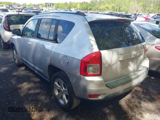 2011 Jeep Compass with VIN 1J4NT1FA1BD260206, listed as a IAAI auction lot 41917357 with 156,168 mi miles. Bid and sale history available at carsss.com. Image 3.