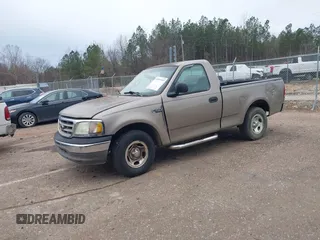 2002 Ford F-150 XL with VIN 3FTRF17212MA23970, listed as a IAAI auction lot 40991449 with 216,487 mi miles. Bid and sale history available at carsss.com. Image 2.