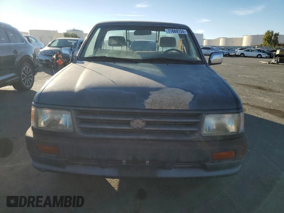 1993 Toyota T100 z VIN JT4VD10C2P0007486, wystawiony jako Copart lot #77669724 z przebiegiem 150 936 mil mil oraz Tytuł czysty. Historia ofert i sprzedaży dostępna na DreamBid. Obrazek 5.