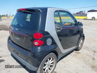 2008 Smart fortwo Pure with VIN WMEEJ31X78K180398, listed as a IAAI auction lot 42193886 with 98,136 mi miles and . Bid and sale history available at DreamBid. Image 4.