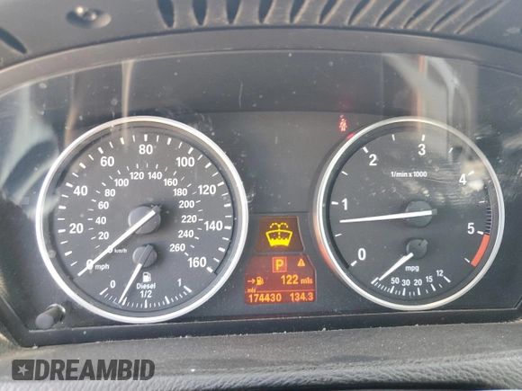 2012 BMW X5 35d z VIN 5UXZW0C59CL670242, wystawiony jako Copart lot #57638165 z przebiegiem 174 430 mil mil oraz Szkoda całkowita • Salvage title. Historia ofert i sprzedaży dostępna na DreamBid. Obrazek 9.