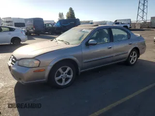 2001 Nissan Maxima SE 20th Anniversary. z VIN JN1CA31A91T314977, wystawiony jako Copart lot #75260034 z przebiegiem 178 471 mil mil oraz Szkoda całkowita • Salvage title. Historia ofert i sprzedaży dostępna na DreamBid. Obrazek 1.
