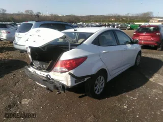 2014 Hyundai Accent GLS with VIN KMHCT4AEXEU669197, listed as a IAAI auction lot 36165921 with 94,315 mi miles. Bid and sale history available at carsss.com. Image 4.