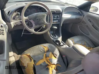 1999 Ford Mustang с VIN 1FAFP4049XF207029, выставлен на аукционе Copart как лот 60026465 с пробегом 158 209 миль миль и Списание • Salvage title. История ставок и продаж доступна на DreamBid. Изображение 8.
