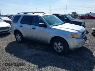 2010 Ford Escape XLT with VIN 1FMCU9D70AKD46774, listed as a IAAI auction lot 41857882 with 93,409 mi miles. Bid and sale history available at carsss.com. Image 1.