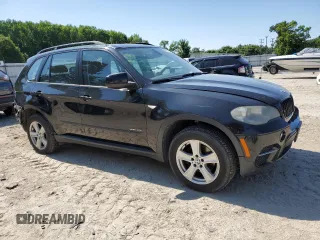2012 BMW X5 35i z VIN 5UXZV4C52CL748838, wystawiony jako Copart lot #58051155 z przebiegiem 224 088 mil mil oraz Czysty tytuł • Clean title. Historia ofert i sprzedaży dostępna na DreamBid. Obrazek 4.